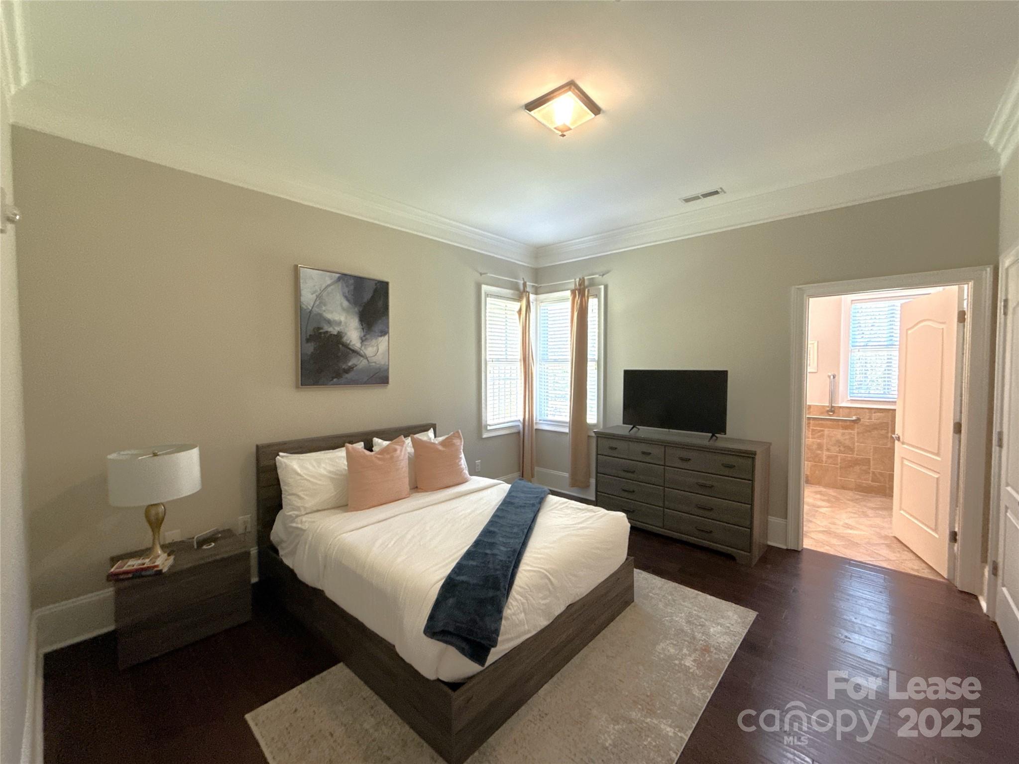 14019 Thompson Road Charlotte, NC 28227 - Photo 32 of 43 a bedroom with a bed and wooden floor