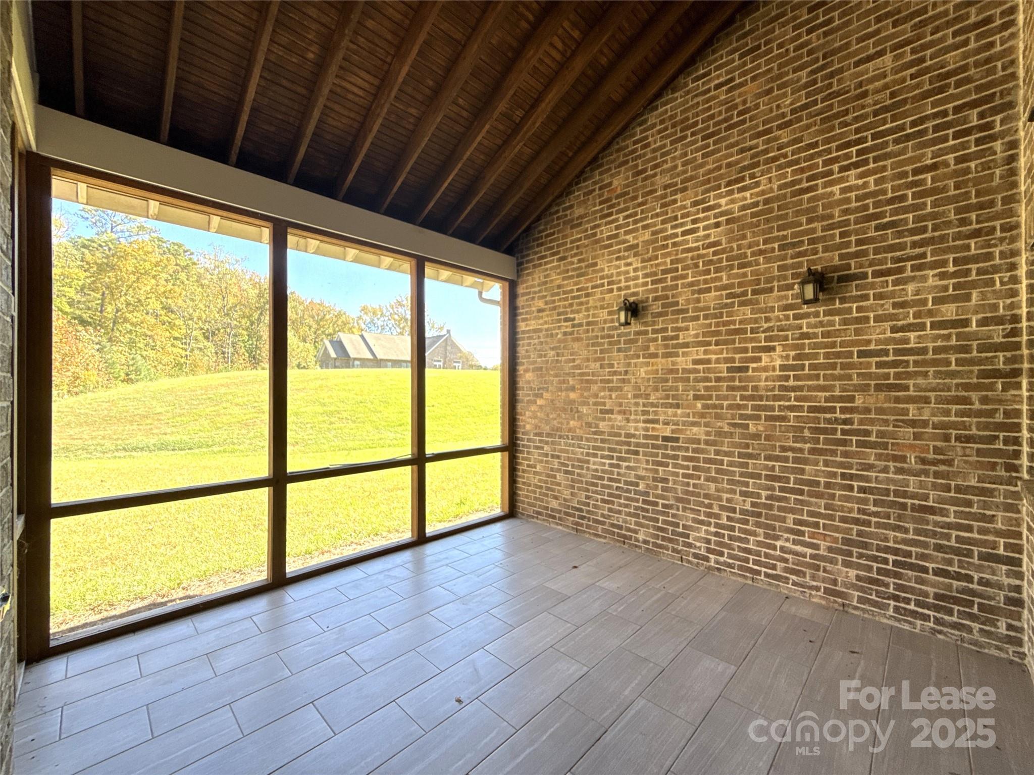 14019 Thompson Road Charlotte, NC 28227 - Photo 39 of 43 a view of empty room with wooden floor and fan