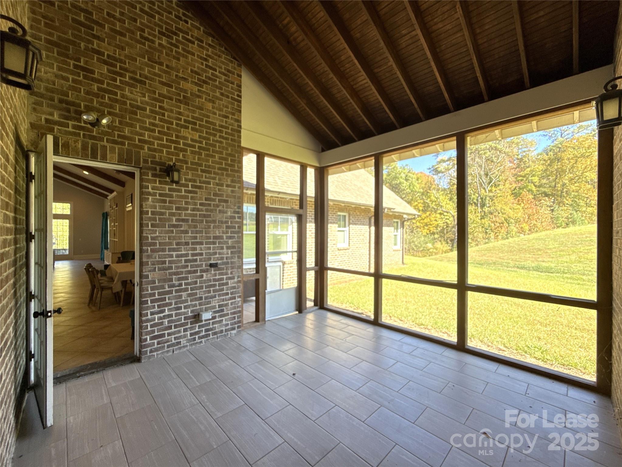 14019 Thompson Road Charlotte, NC 28227 - Photo 40 of 43 a view of empty room with wooden floor and fan