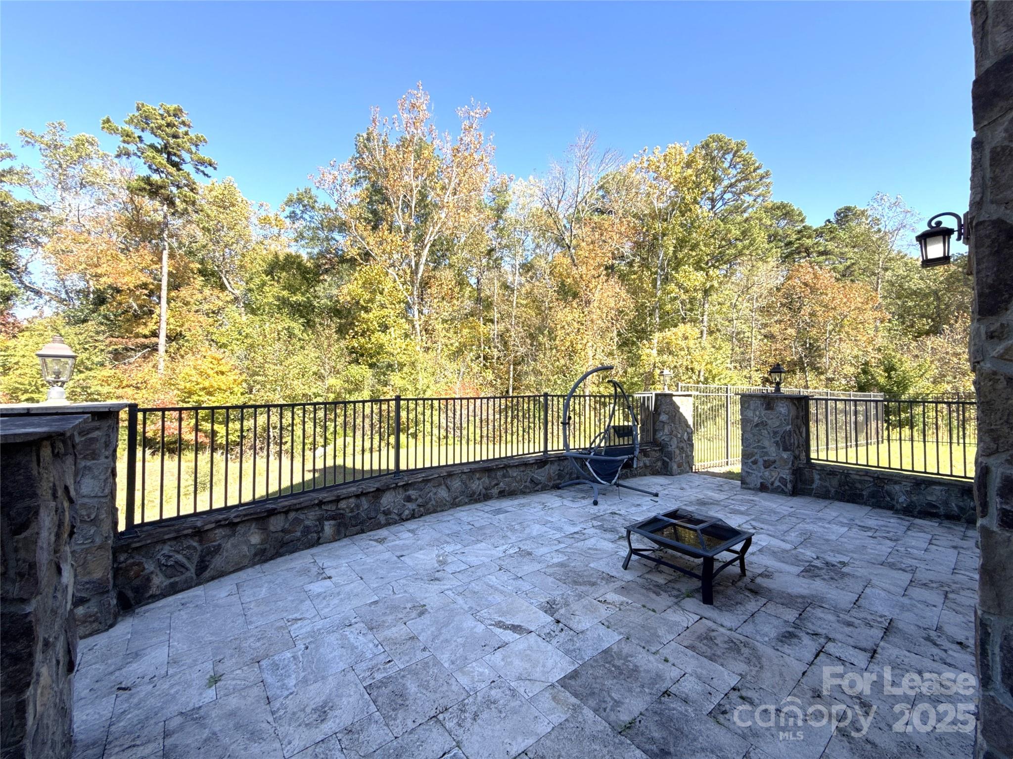 14019 Thompson Road Charlotte, NC 28227 - Photo 41 of 43 a view of a backyard with large trees and wooden fence