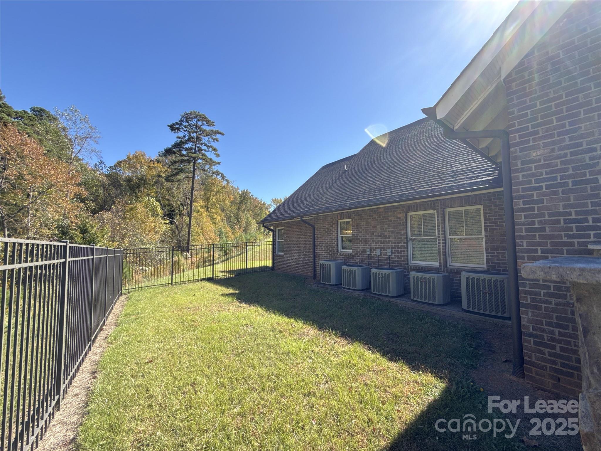 14019 Thompson Road Charlotte, NC 28227 - Photo 42 of 43 a view of a house with a yard