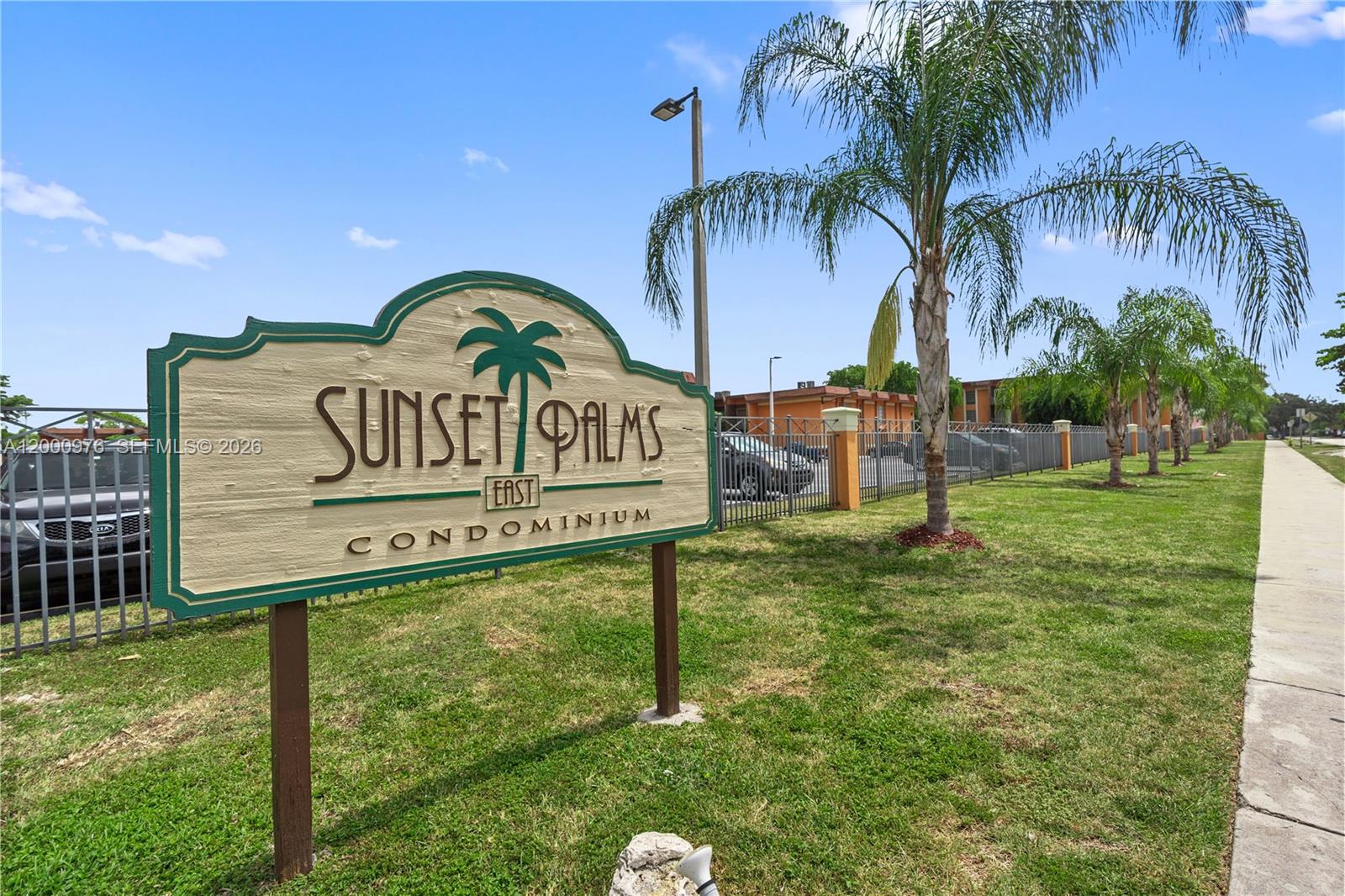 a view of outdoor space with sign board and garden