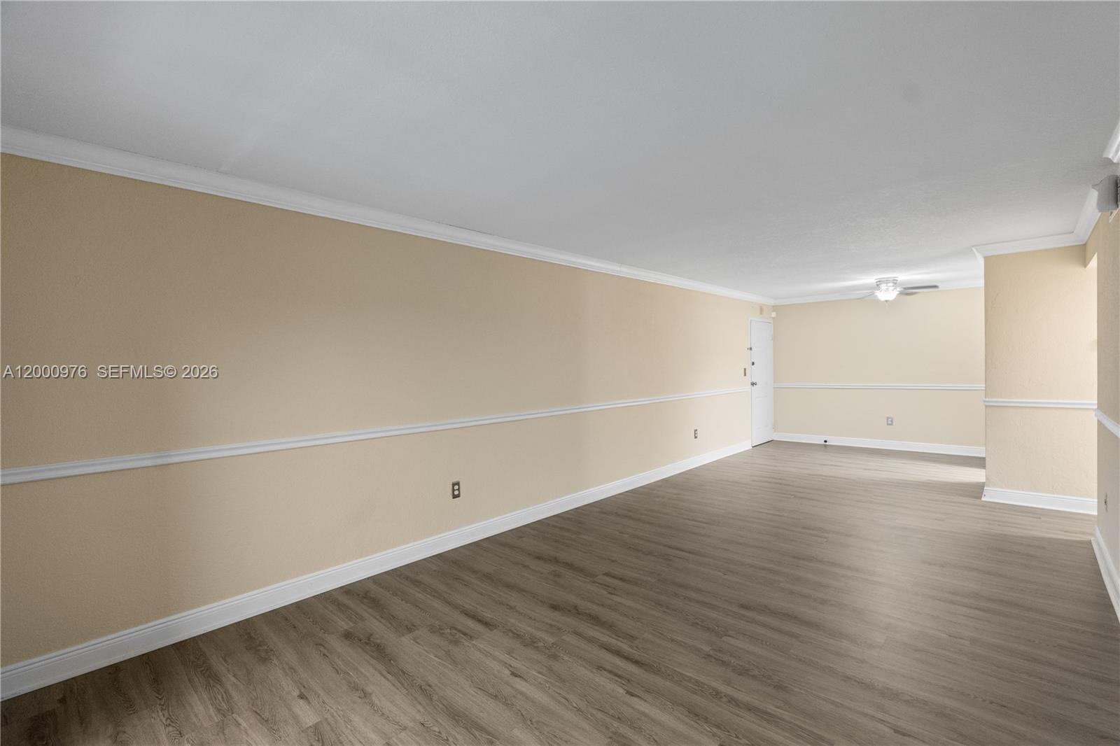 9441 Southwest 76th Street, Unit V32 Miami, FL 33173 - Photo 11 of 28 a view of an empty room with wooden floor