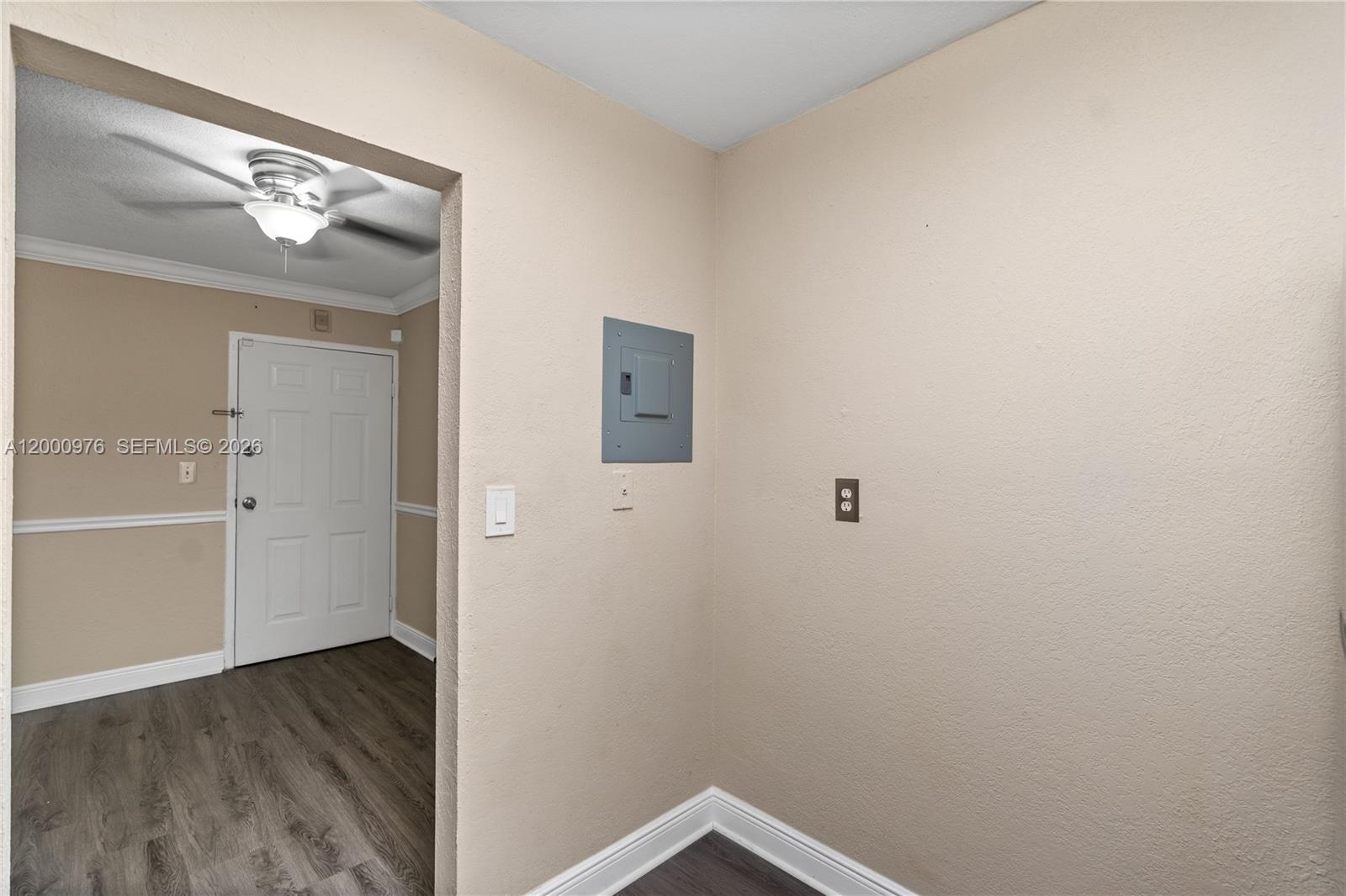 9441 Southwest 76th Street, Unit V32 Miami, FL 33173 - Photo 13 of 28 a view of a hallway with wooden floor