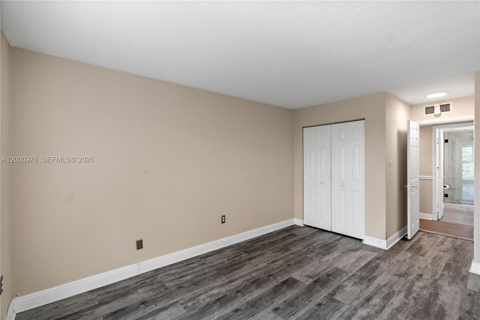 9441 Southwest 76th Street, Unit V32 Miami, FL 33173 - Photo 16 of 28 a view of room with wooden floor