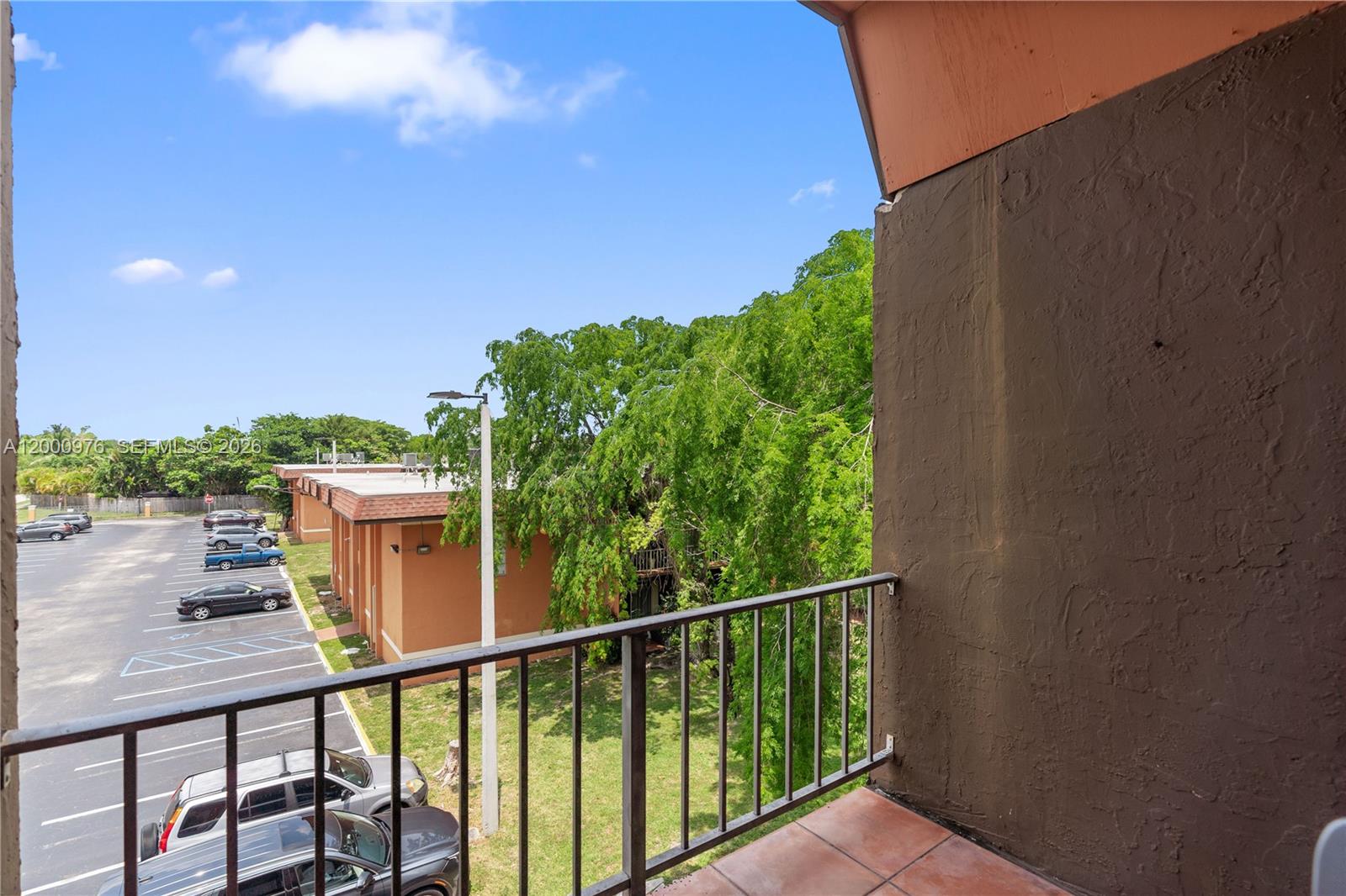 9441 Southwest 76th Street, Unit V32 Miami, FL 33173 - Photo 25 of 28 a view of a balcony with chairs