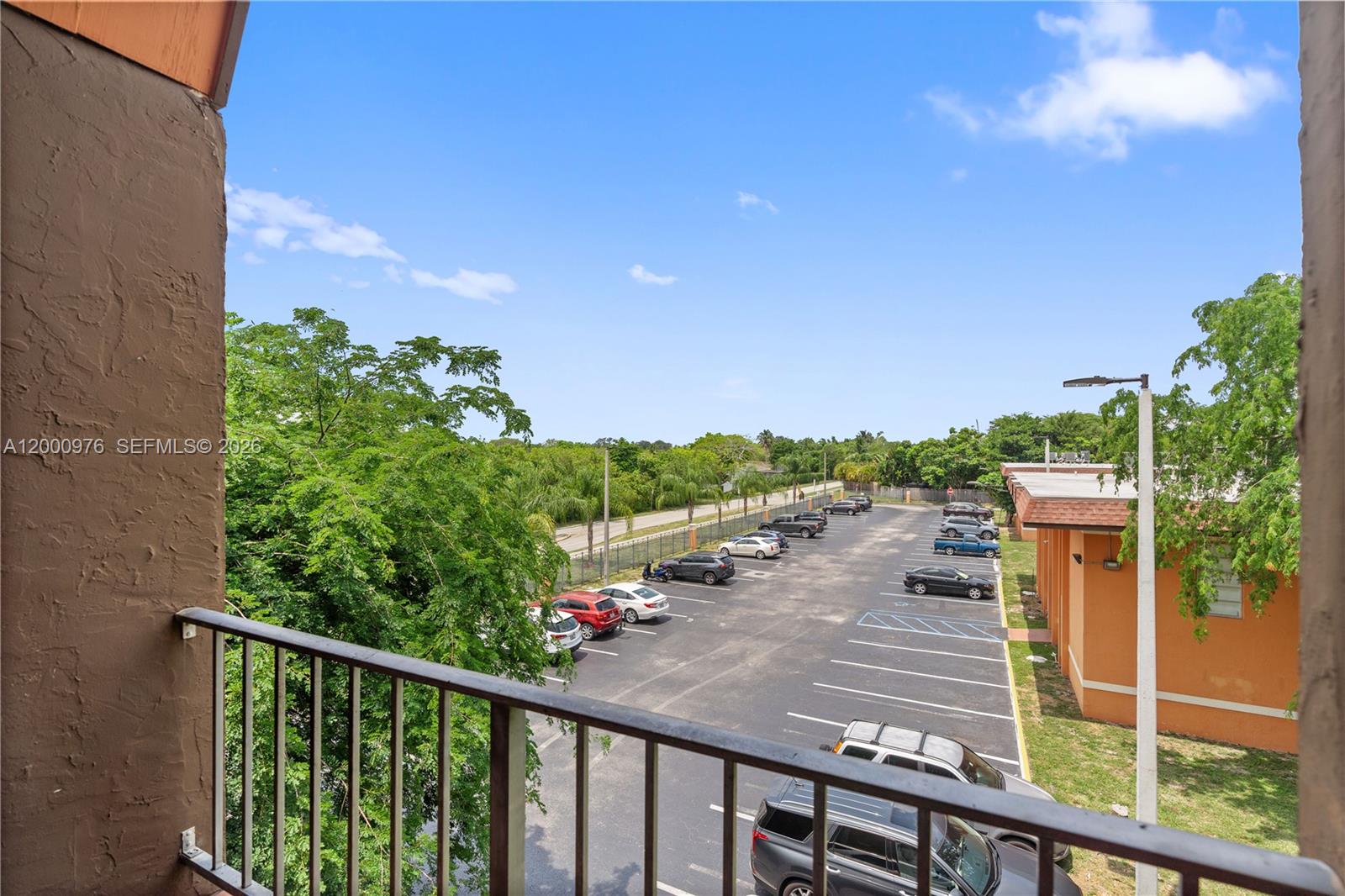 9441 Southwest 76th Street, Unit V32 Miami, FL 33173 - Photo 26 of 28 a view of a balcony with lake view