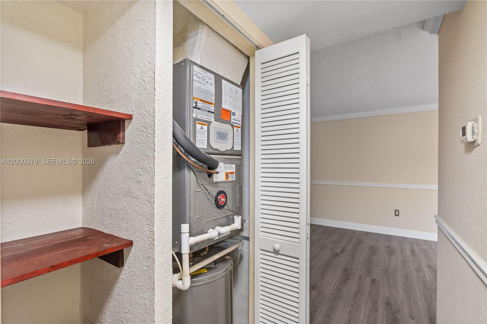 9441 Southwest 76th Street, Unit V32 Miami, FL 33173 - Photo 5 of 28 a room with storage and utility
