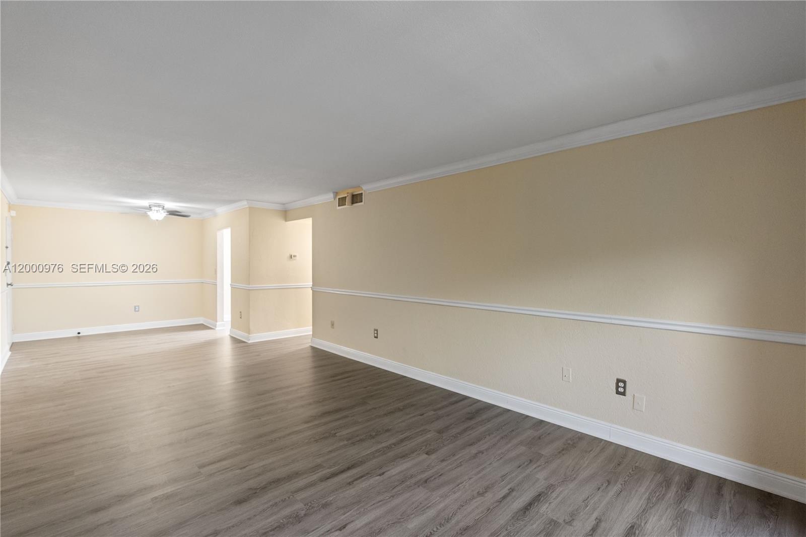 9441 Southwest 76th Street, Unit V32 Miami, FL 33173 - Photo 10 of 28 a view of an empty room and wooden floor
