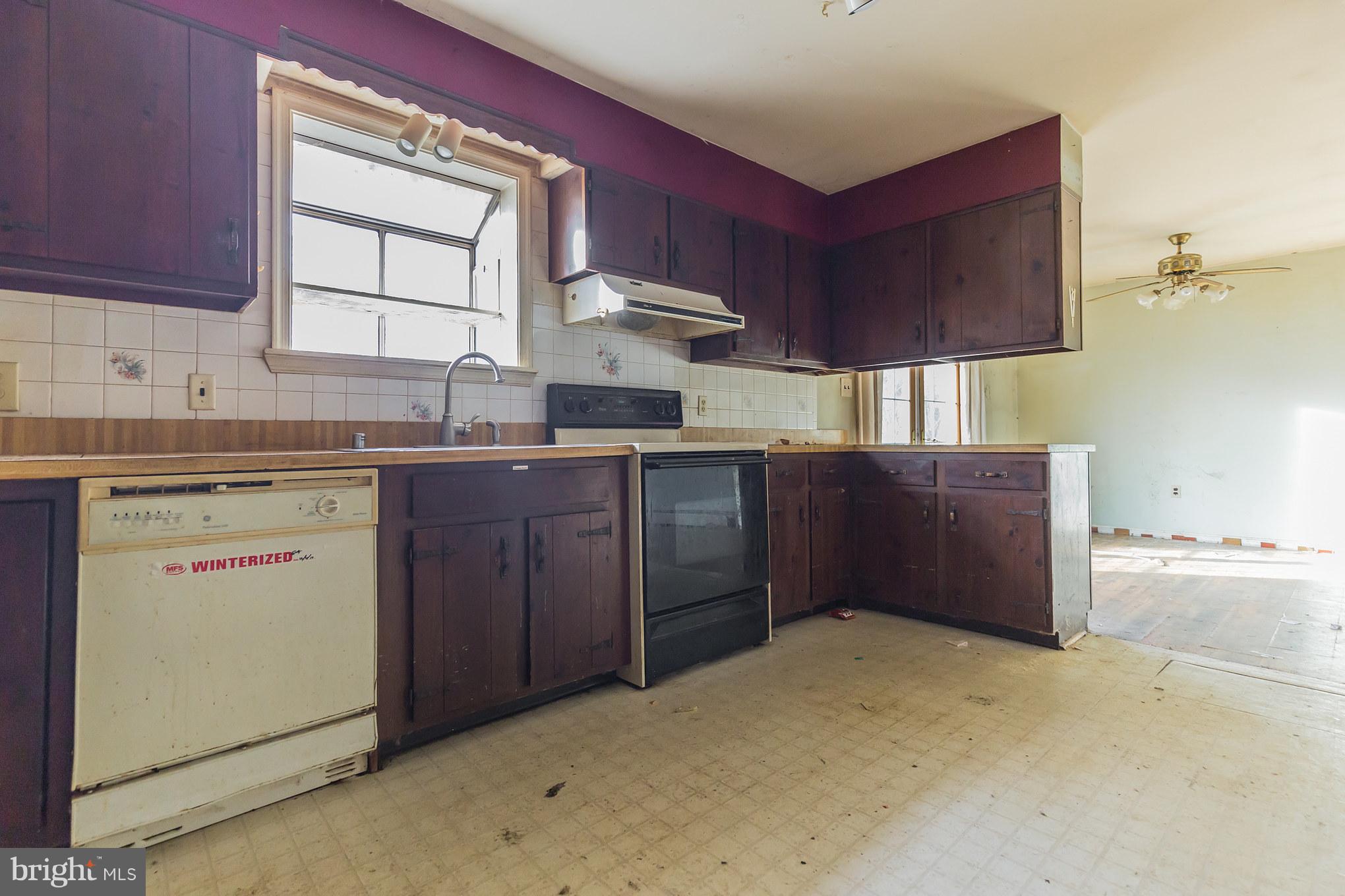 369 Friendship Road Friendship, MD 20758 - Photo 11 of 18 a kitchen with a sink cabinets and window