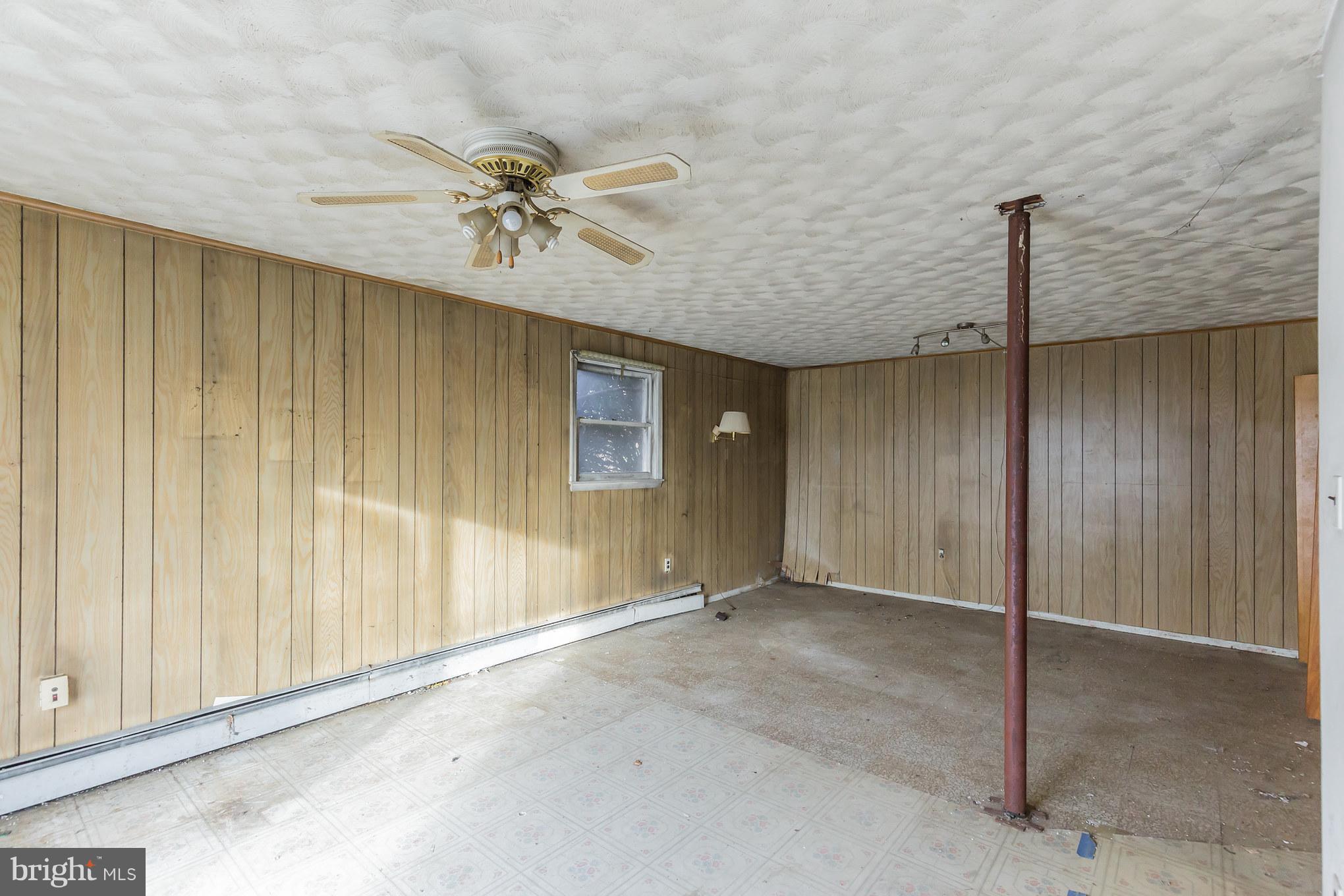 369 Friendship Road Friendship, MD 20758 - Photo 14 of 18 an empty room with windows and fan