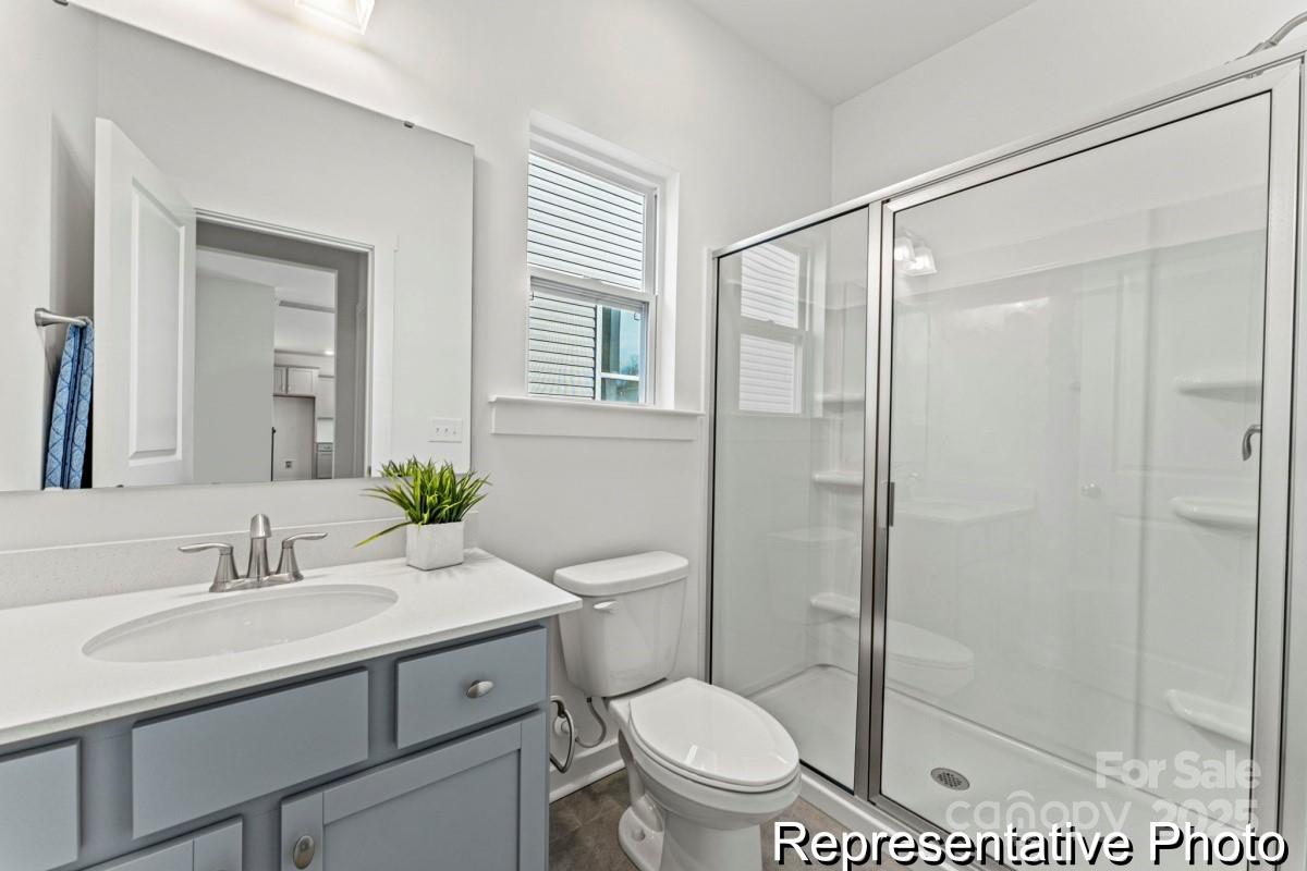 111 West Rice Planters Way, Unit 2P Statesville, NC 28625 - Photo 12 of 19 a bathroom with a sink toilet and shower