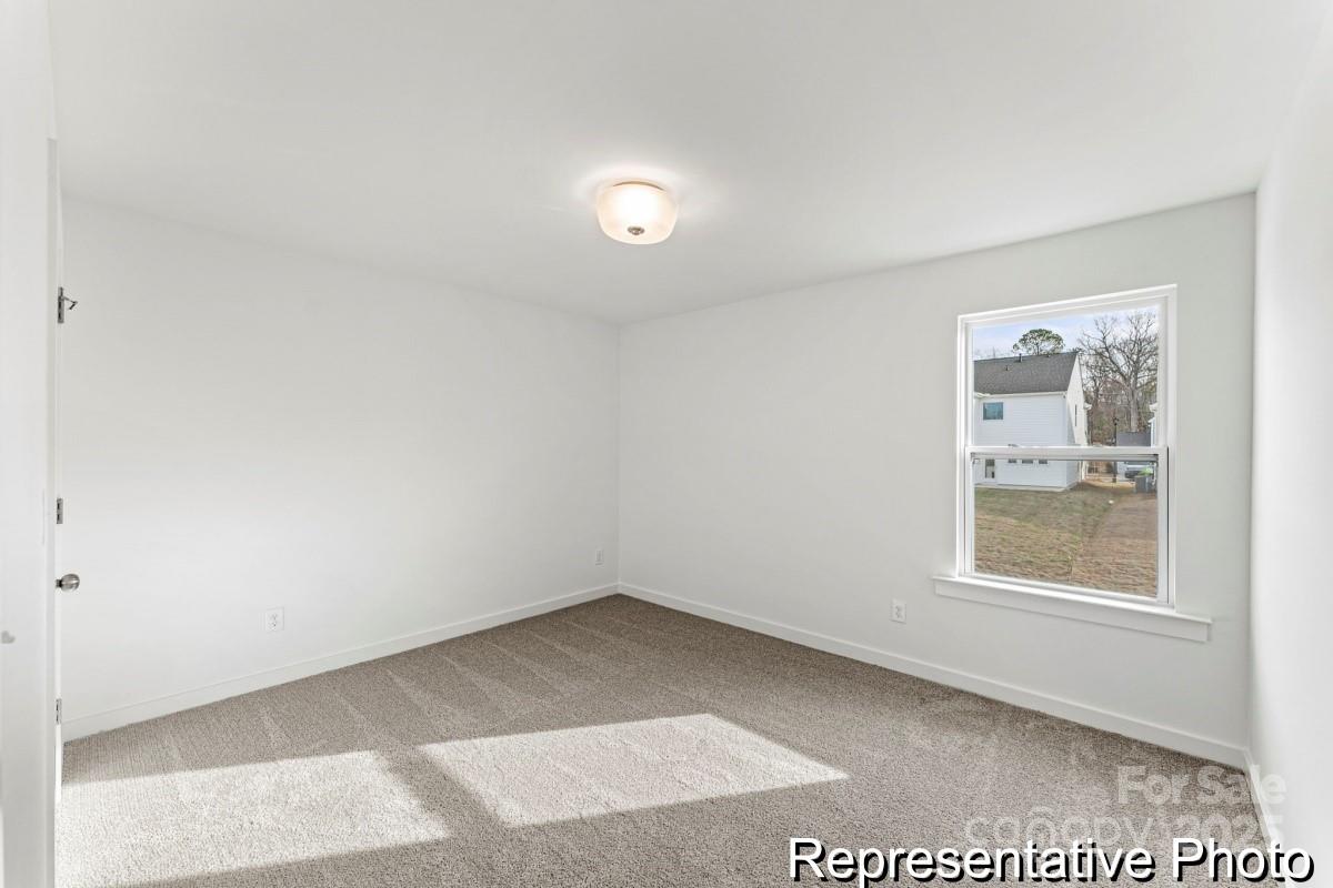 111 West Rice Planters Way, Unit 2P Statesville, NC 28625 - Photo 13 of 19 an empty room with windows