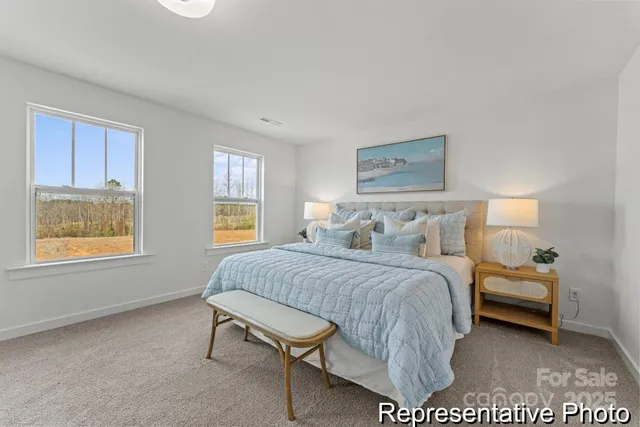 a bed room with a bed and a window