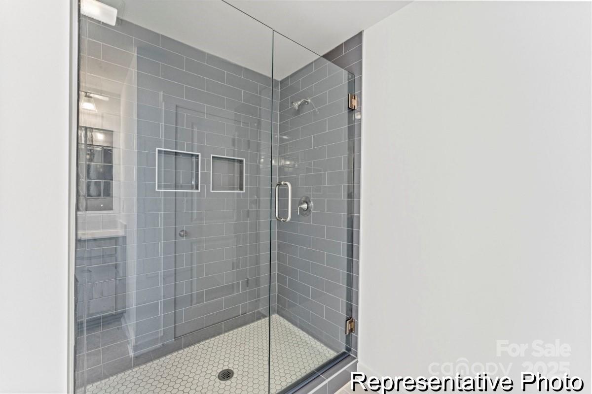 111 West Rice Planters Way, Unit 2P Statesville, NC 28625 - Photo 18 of 19 a bathroom with a shower and a sink