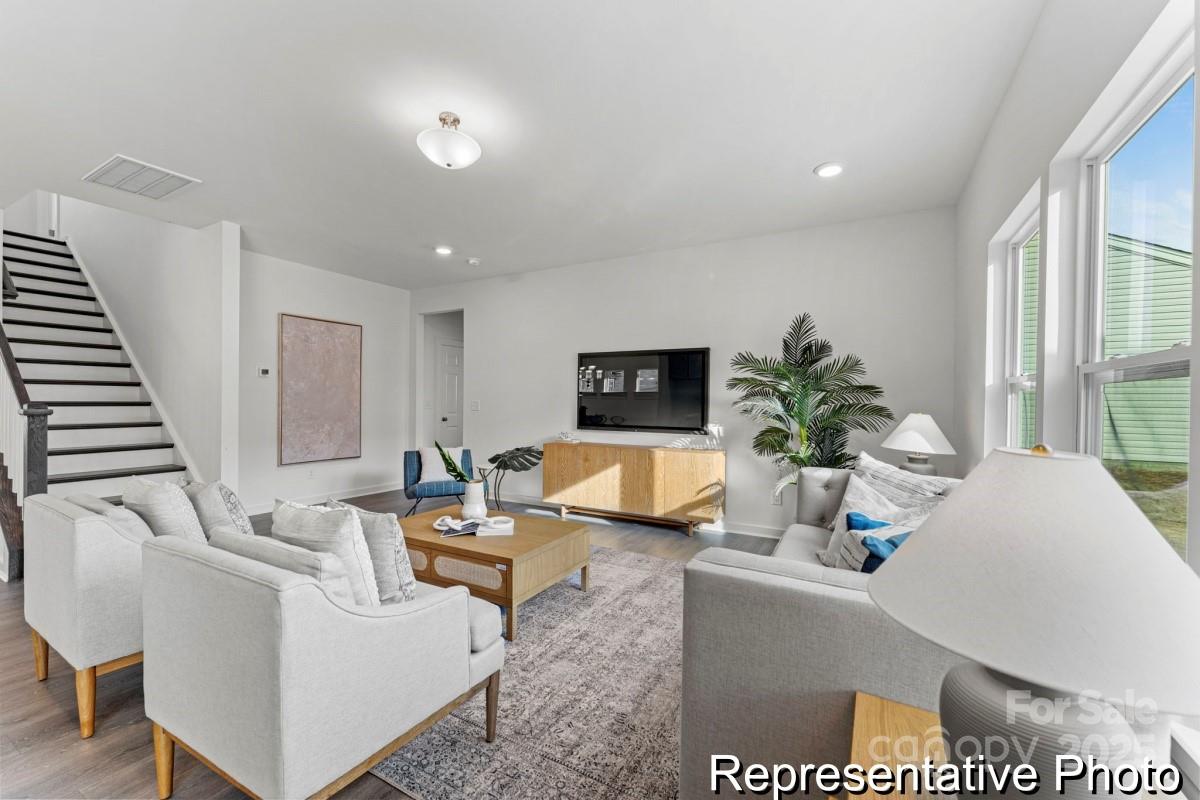 111 West Rice Planters Way, Unit 2P Statesville, NC 28625 - Photo 6 of 19 a living room with furniture and a large window