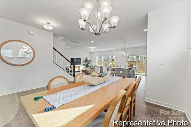 a very nice looking dining room with a table and chairs