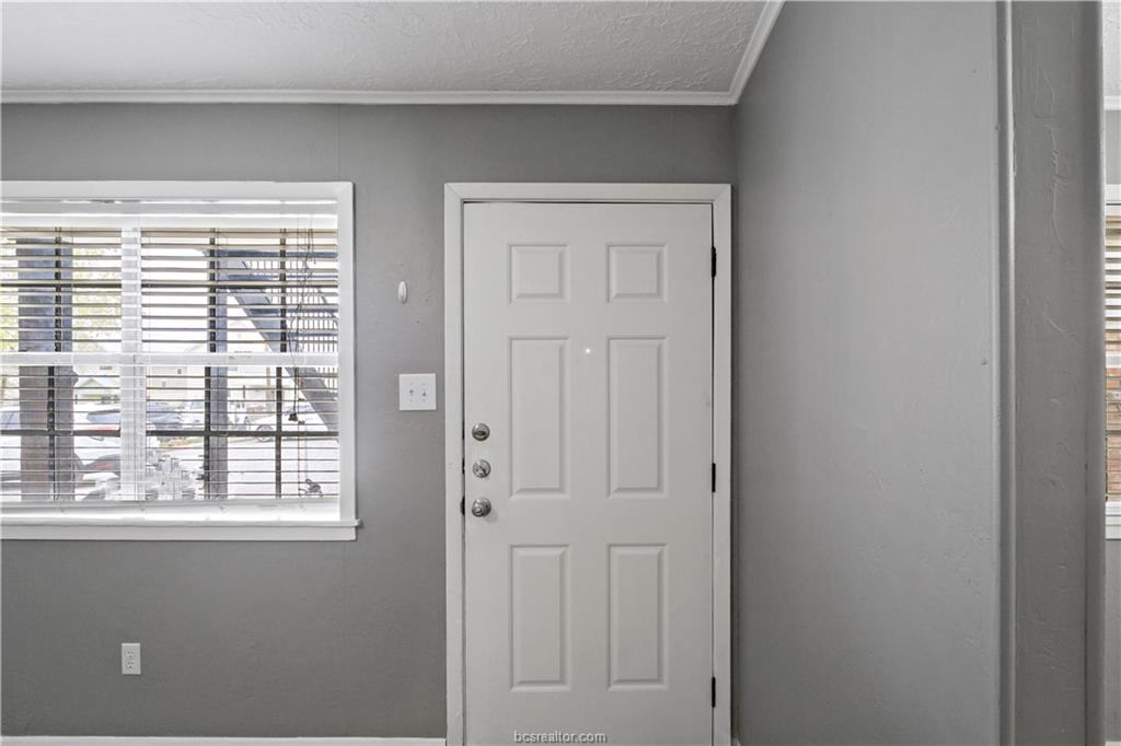 3906 Aspen Street, Unit C Bryan, TX 77801 - Photo 2 of 16 a view of an empty room with a window