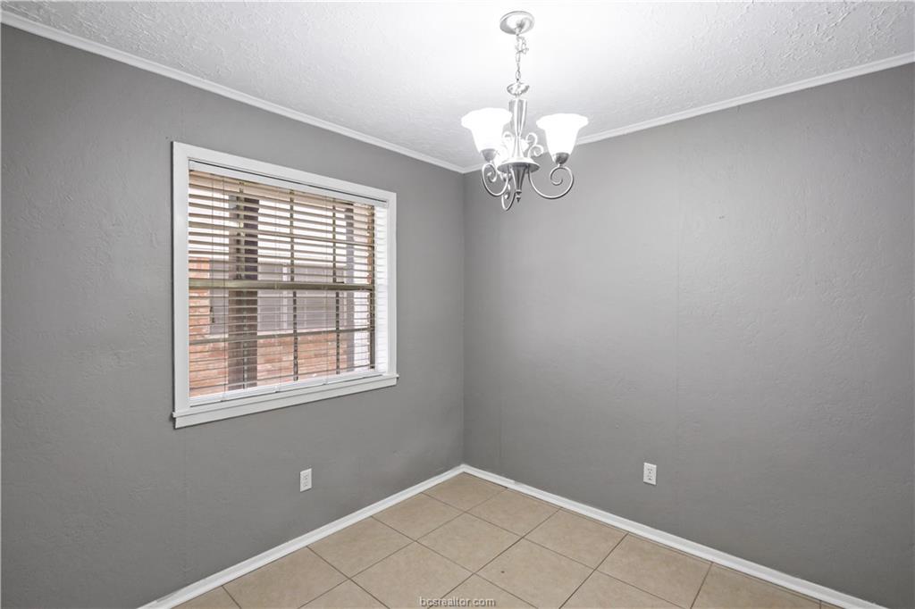 3906 Aspen Street, Unit C Bryan, TX 77801 - Photo 6 of 16 a view of an empty room with a window