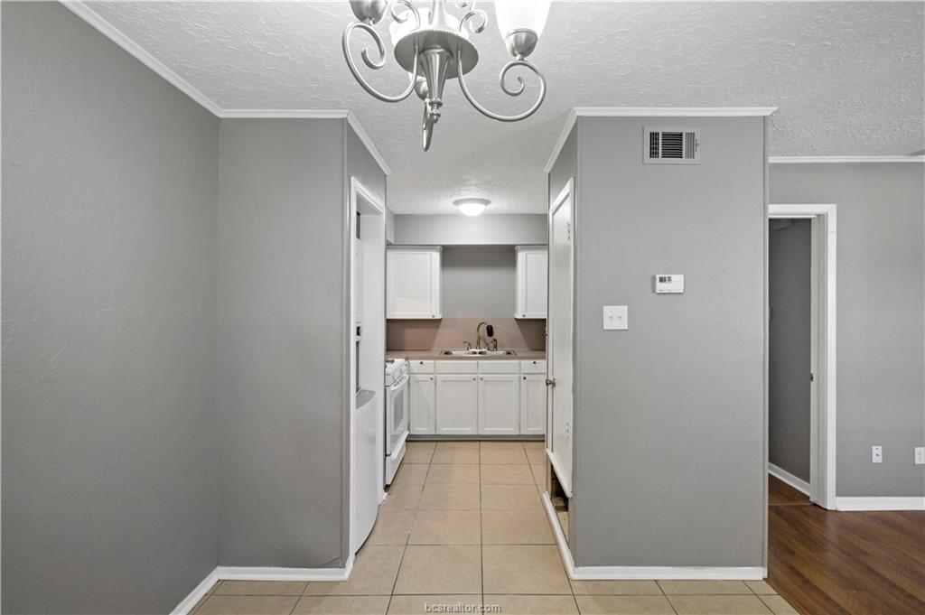 3906 Aspen Street, Unit C Bryan, TX 77801 - Photo 8 of 16 a view of a hallway with washer and dryer