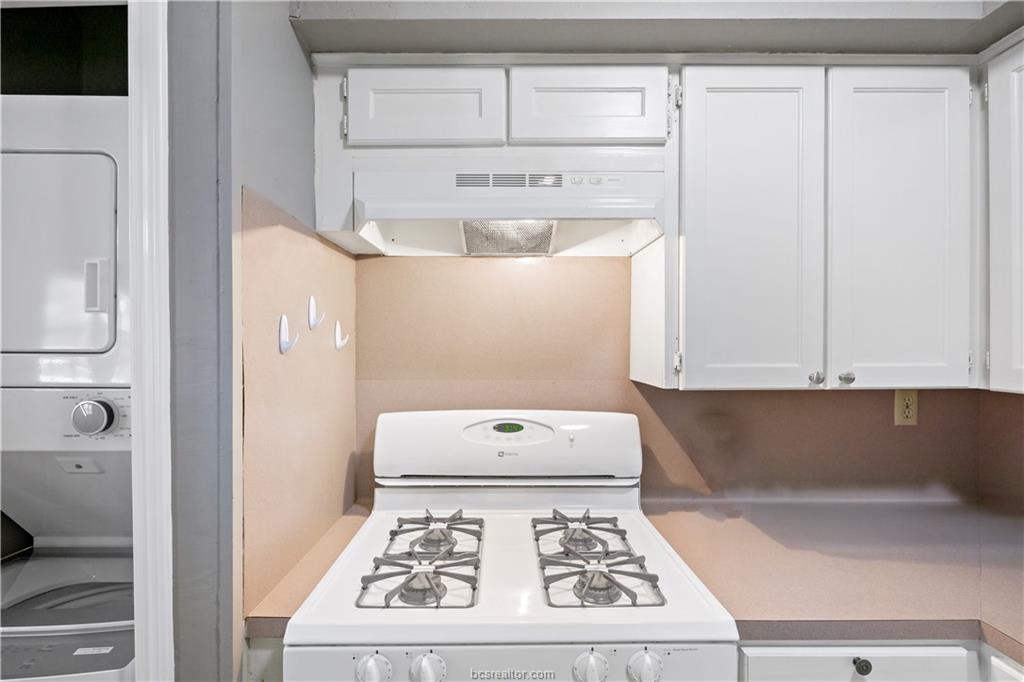 3906 Aspen Street, Unit C Bryan, TX 77801 - Photo 10 of 16 a white stove top oven sitting inside of a kitchen