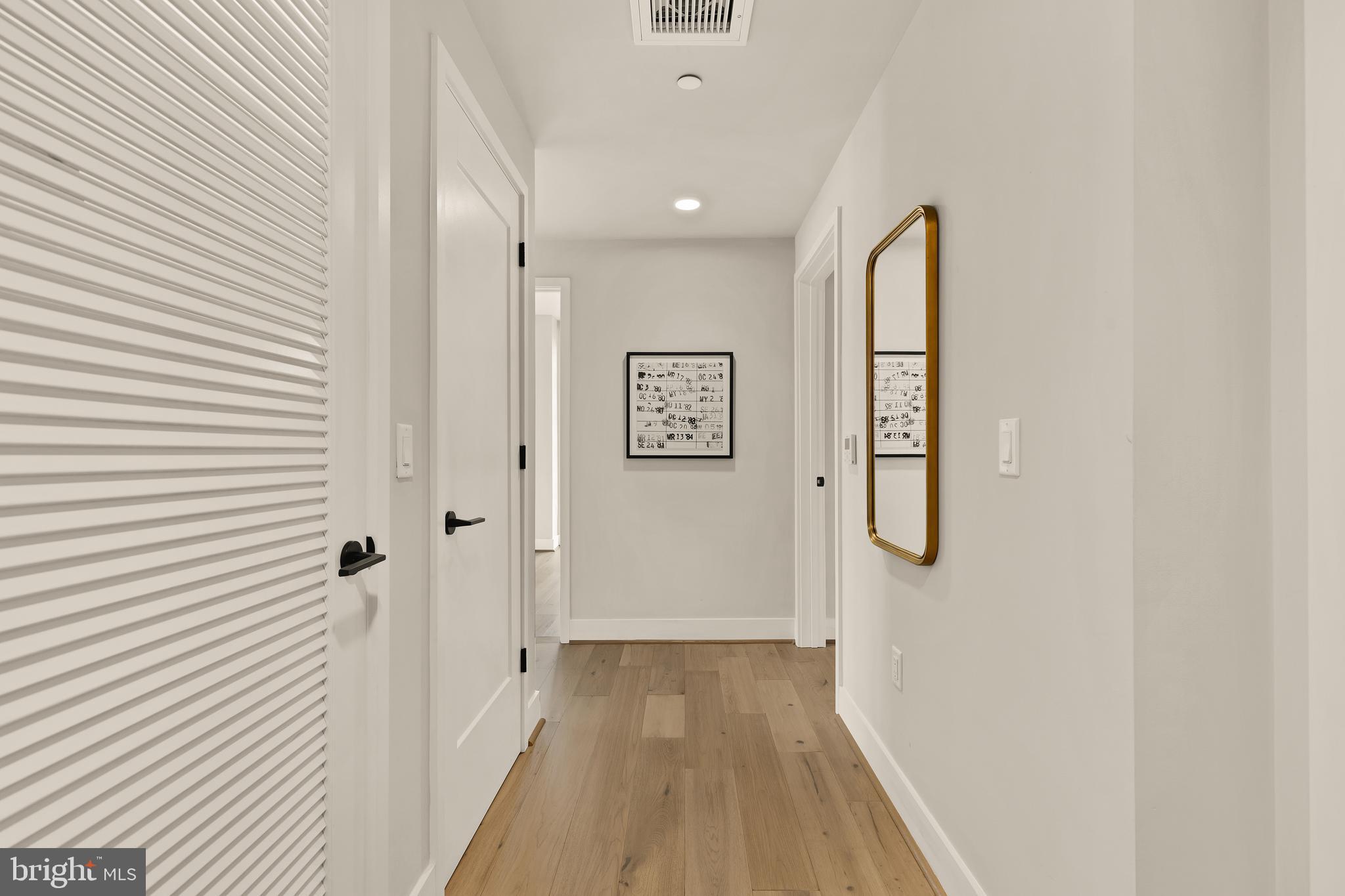 1300 4th Street Southeast, Unit 812 Washington, DC 20003 - Photo 27 of 40 a view of a hallway with wooden floor