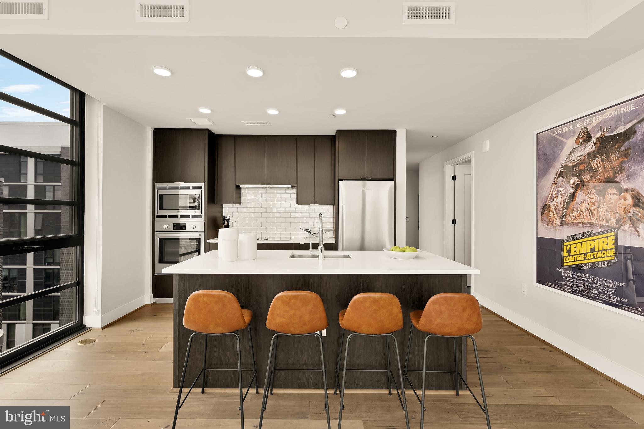 1300 4th Street Southeast, Unit 812 Washington, DC 20003 - Photo 8 of 40 a large kitchen with cabinets table and chairs