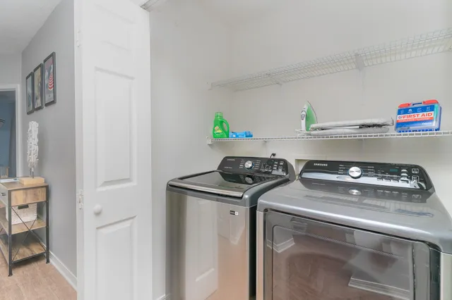 a utility room with washer and dryer