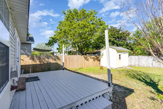 a view of a backyard with wooden floor