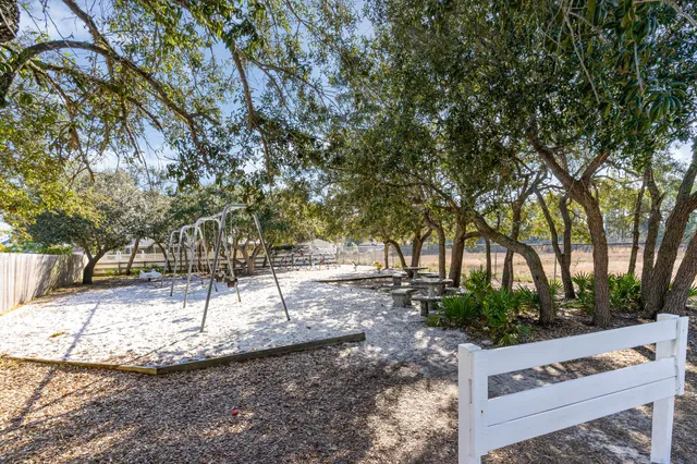 a view of a yard with a tree