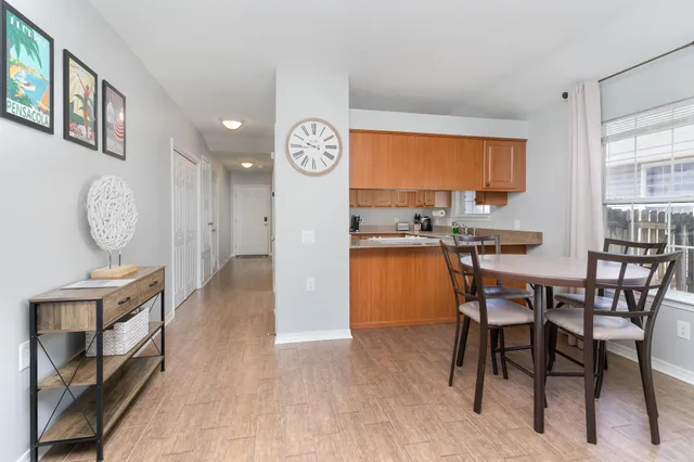 a view of a dining room with furniture window and wooden floor