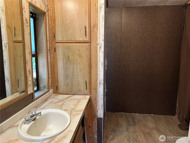 a bathroom with a sink and a mirror