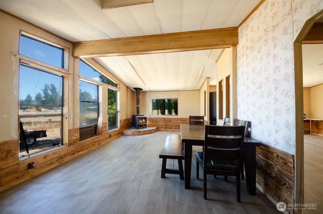 a view of a livingroom with furniture window and outside view