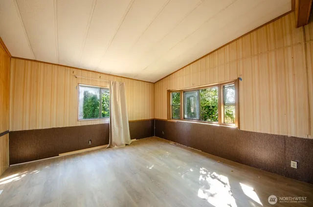 an empty room with windows