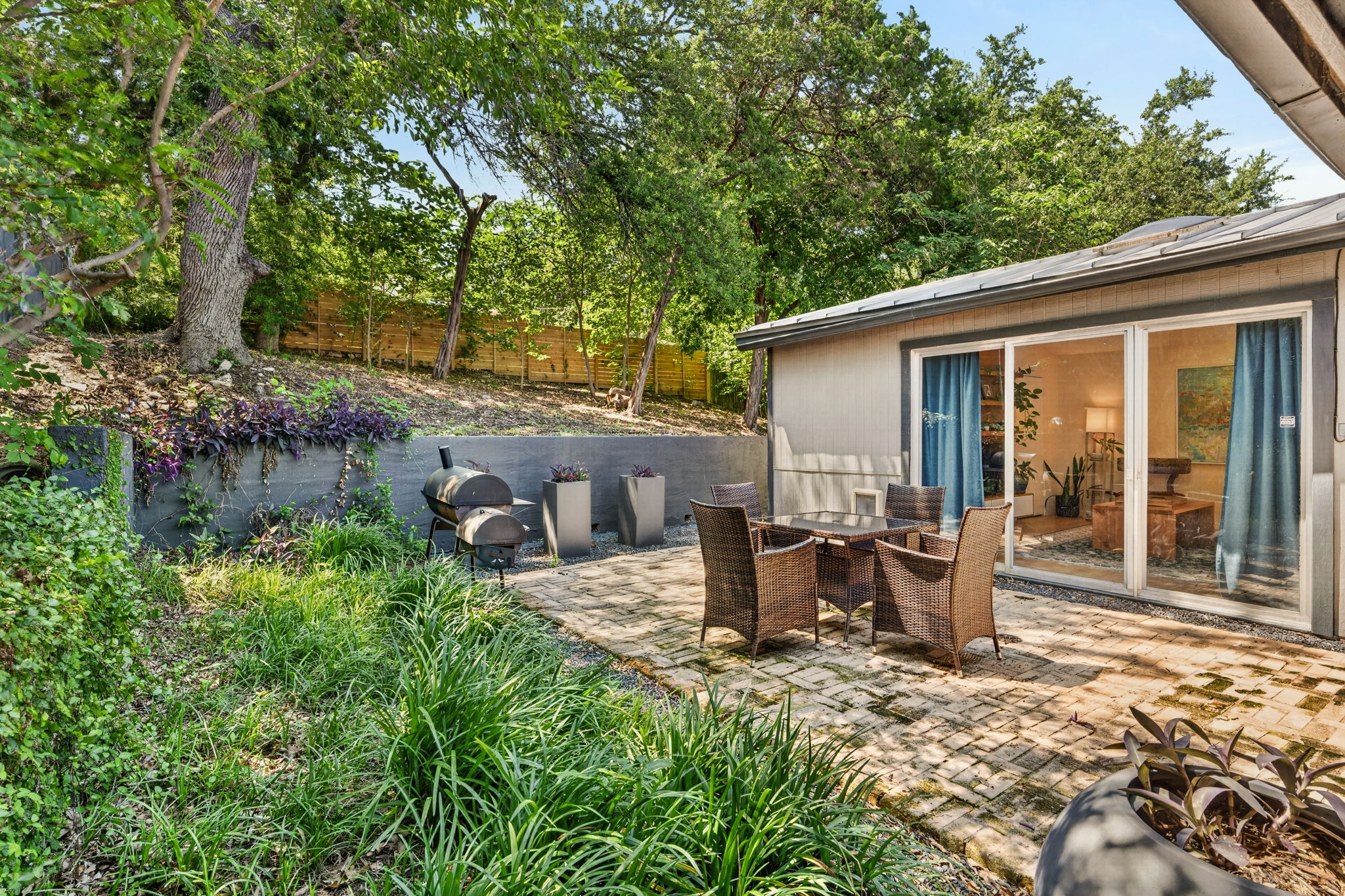3604 Wilson Street Austin, TX 78704 - Photo 23 of 25 a view of backyard of house with seating space