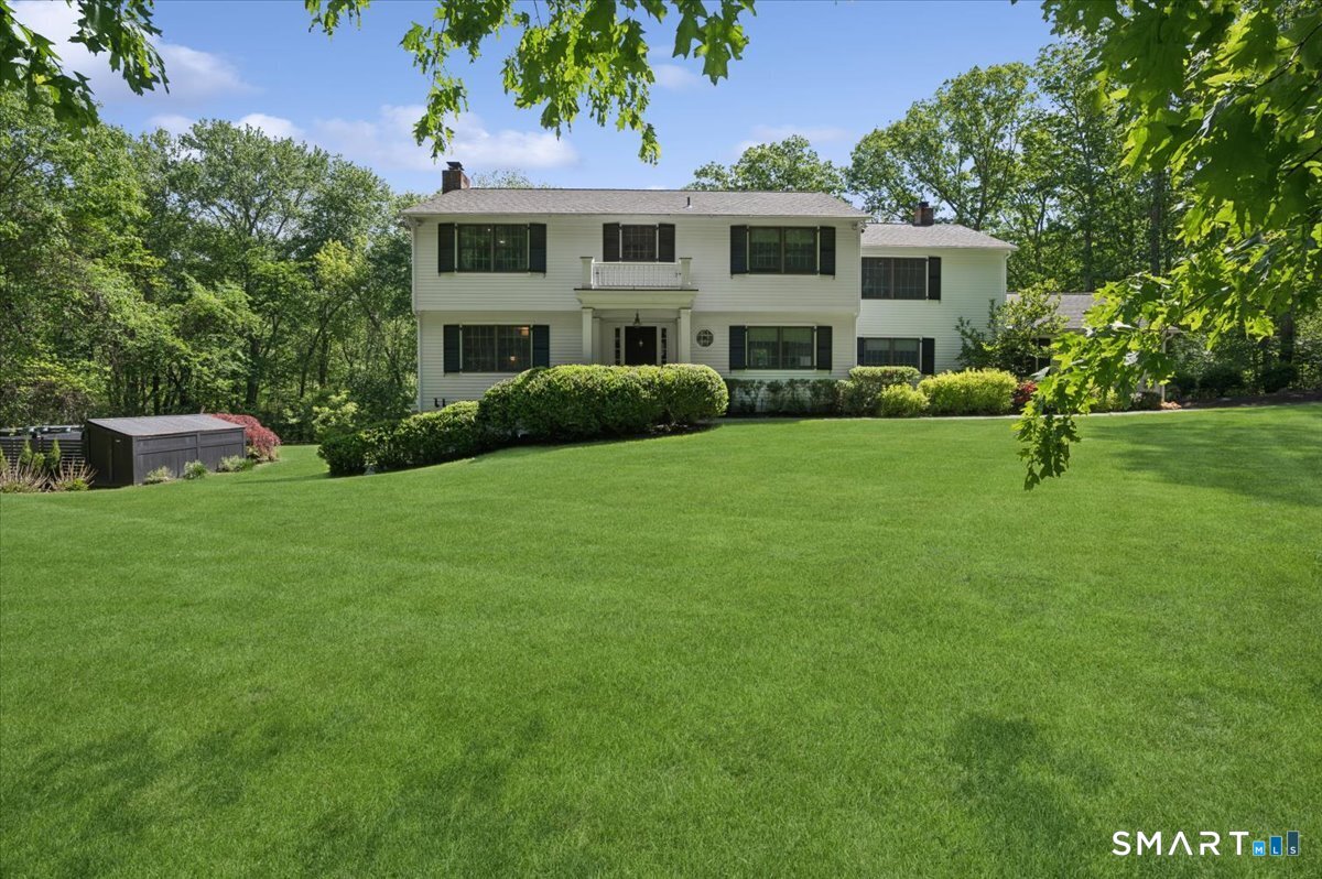 94 Vista Road Wilton, CT 06897 - Photo 38 of 38 a front view of a house with a garden