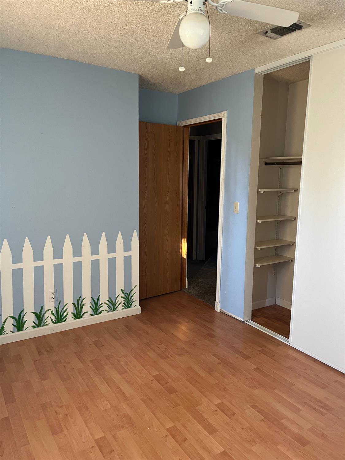 2401 Claridge Lane Stockton, CA 95210 - Photo 11 of 25 a view of an empty room with stairs and a window