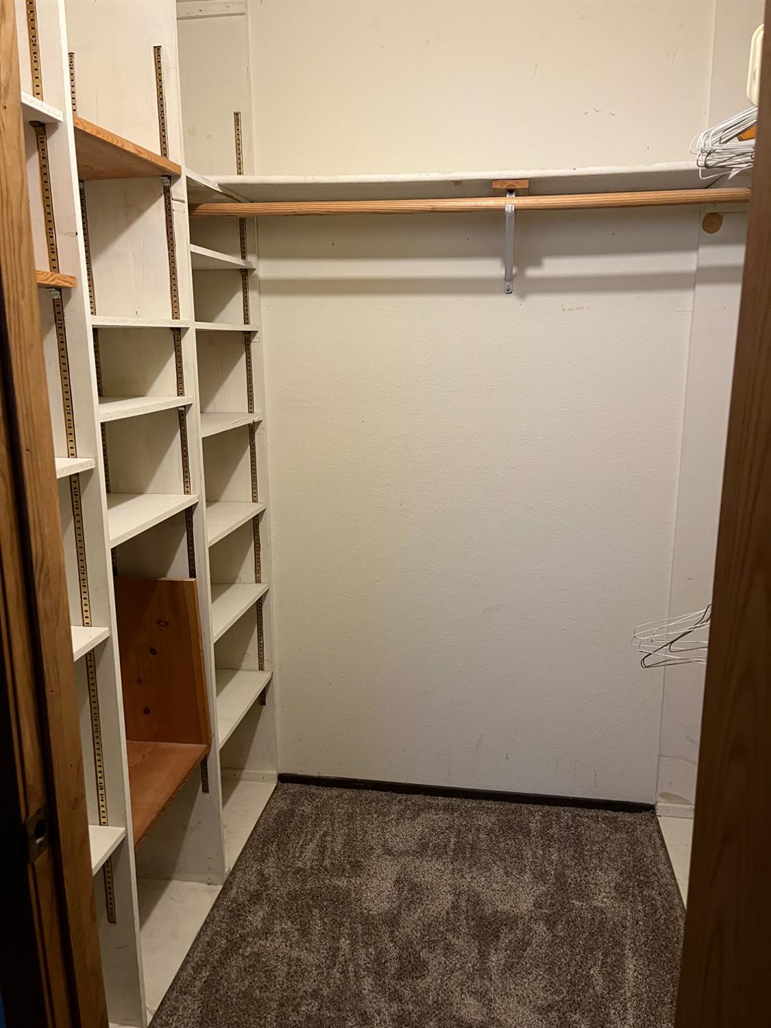 2401 Claridge Lane Stockton, CA 95210 - Photo 15 of 25 a view of walk in closet with empty racks