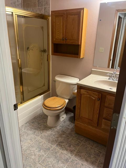 2401 Claridge Lane Stockton, CA 95210 - Photo 16 of 25 a bathroom with a toilet and a shower