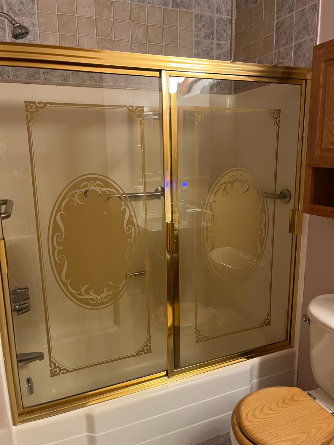 2401 Claridge Lane Stockton, CA 95210 - Photo 17 of 25 a bathroom with a granite countertop toilet and a shower