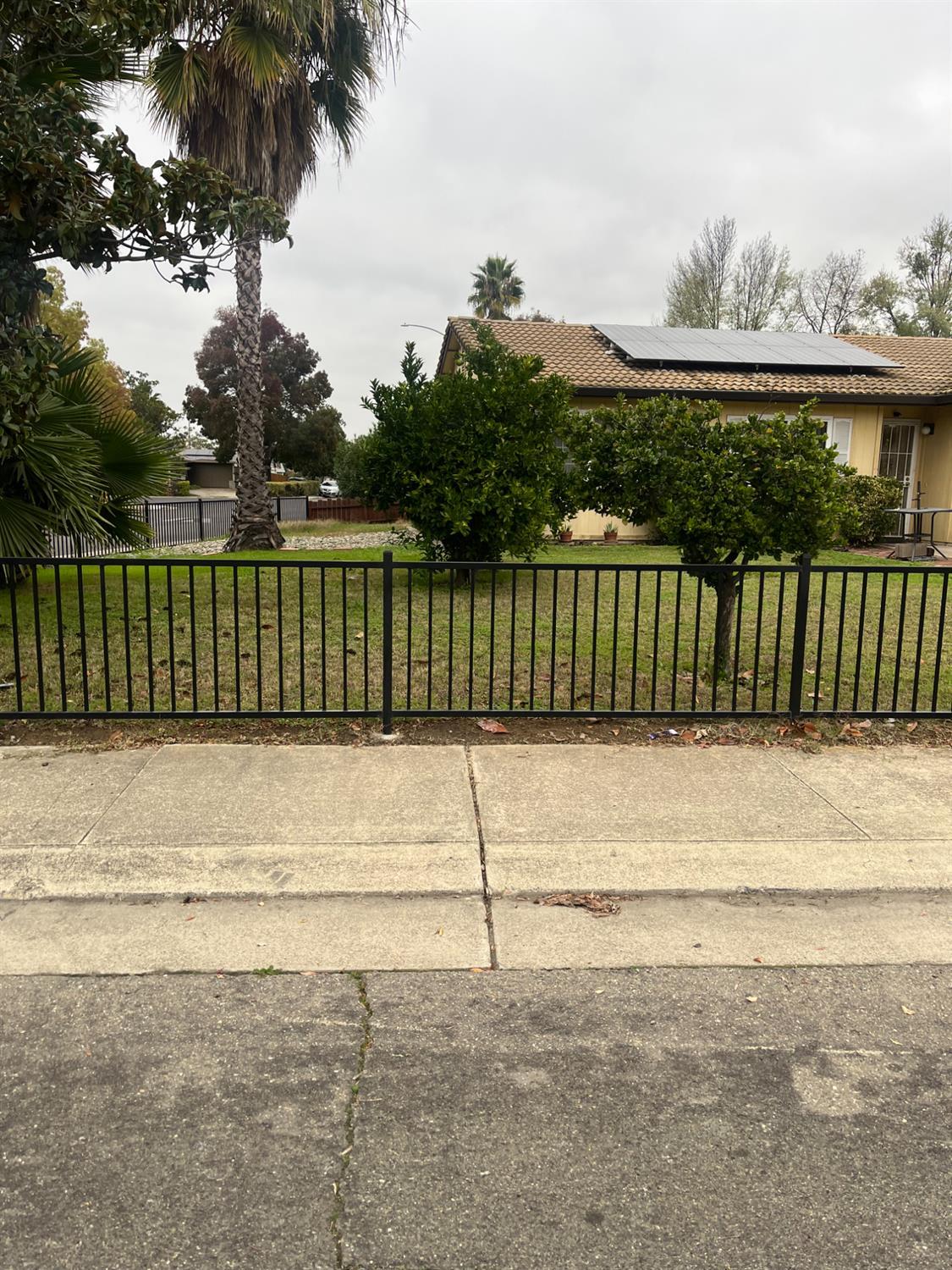2401 Claridge Lane Stockton, CA 95210 - Photo 2 of 25 a view of a yard with a fence