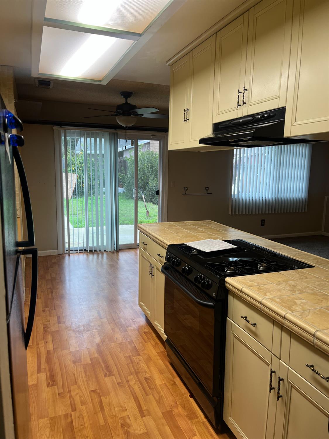 2401 Claridge Lane Stockton, CA 95210 - Photo 4 of 25 a kitchen with a stove and a refrigerator