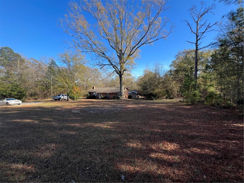 131 Twin Bridges Road Southwest Eatonton, GA 31024 - Photo 11 of 53 a view of road with large trees