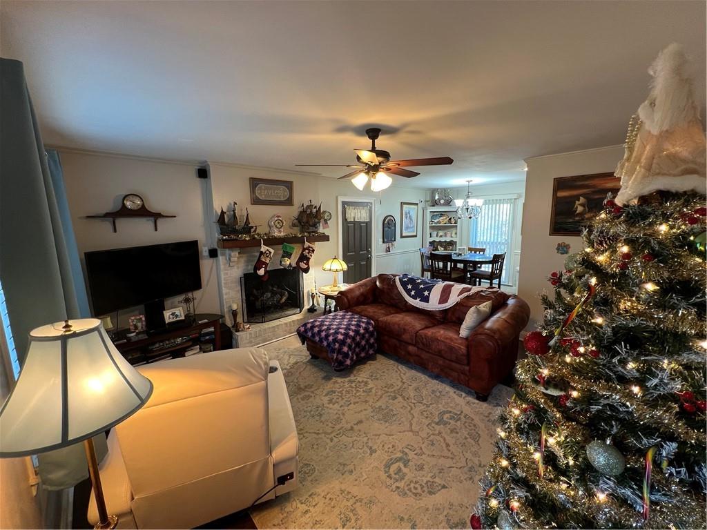 131 Twin Bridges Road Southwest Eatonton, GA 31024 - Photo 16 of 53 a living room with furniture and a flat screen tv