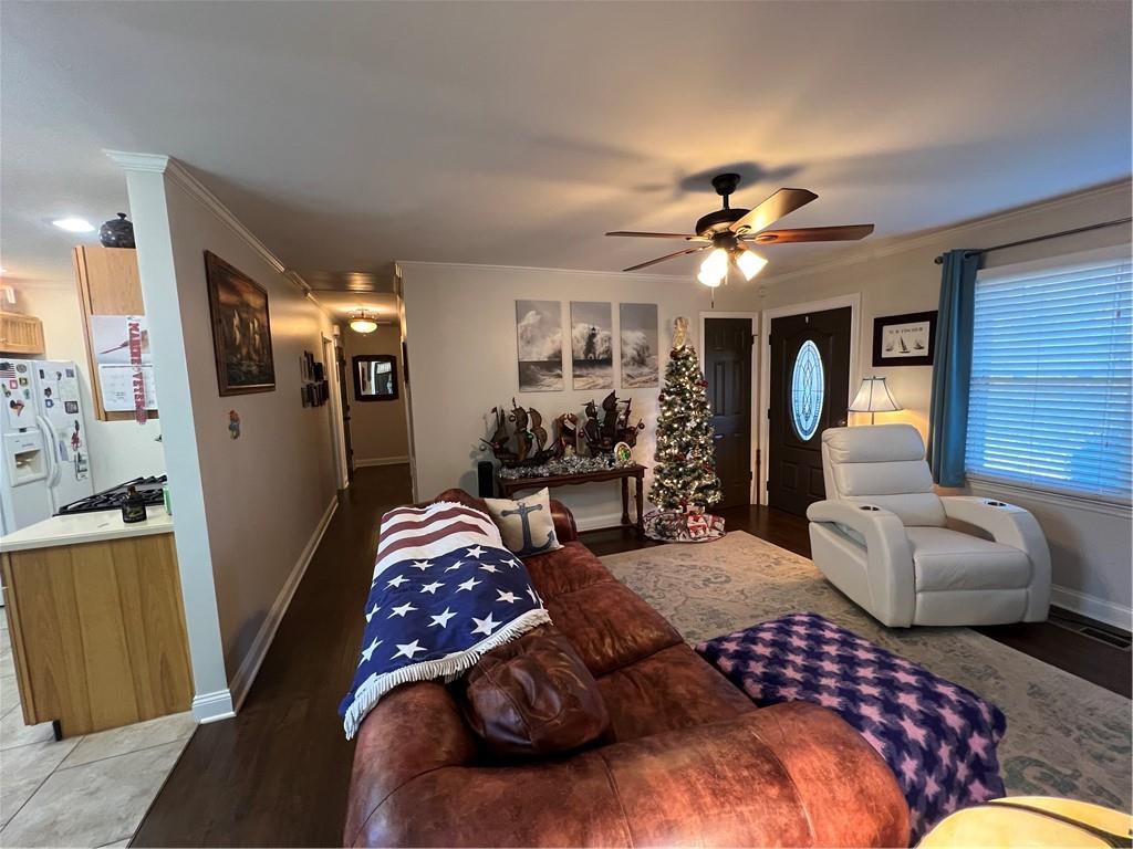 131 Twin Bridges Road Southwest Eatonton, GA 31024 - Photo 19 of 53 a bedroom with furniture and a chandelier