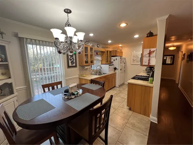 a kitchen with stainless steel appliances granite countertop a refrigerator stove and microwave