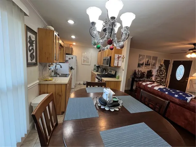 a kitchen with refrigerator and window
