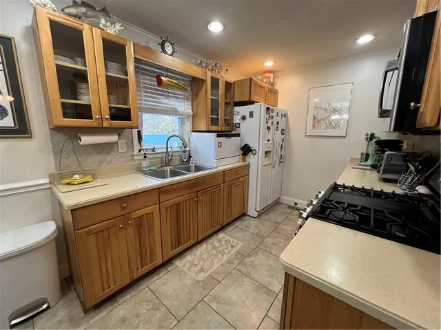 a spacious bedroom with a bed and a chandelier