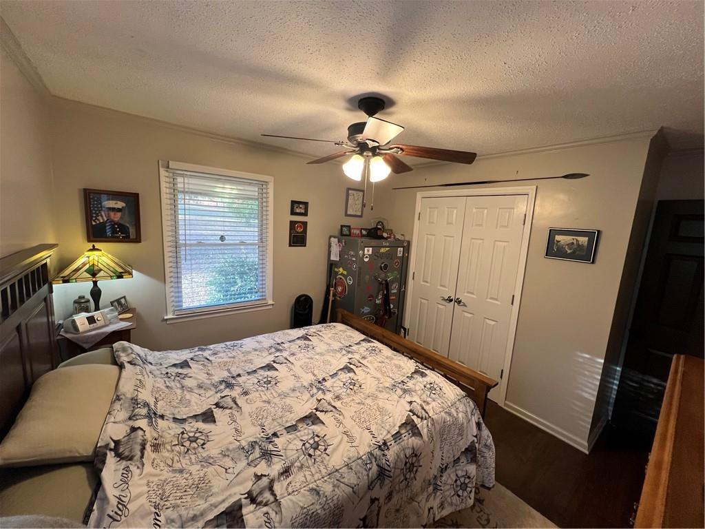 131 Twin Bridges Road Southwest Eatonton, GA 31024 - Photo 26 of 53 a bedroom with a bed and a mirror