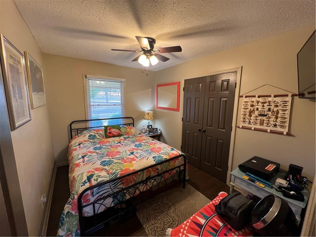 131 Twin Bridges Road Southwest Eatonton, GA 31024 - Photo 31 of 53 a bedroom with a bed and a chandelier